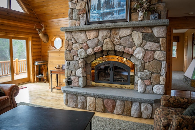 9184 S M-37 Hwy, Wellston, MI 49689 - detailed view of a stone fireplace, wood finished floors, and wood ceiling