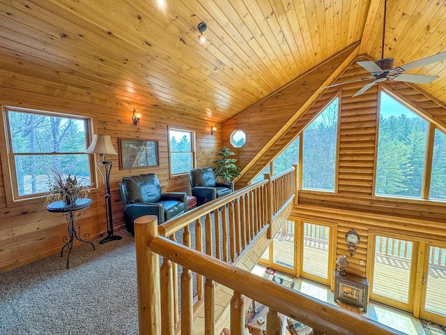 9184 S M-37 Hwy, Wellston, MI 49689 - hallway featuring wood ceiling, high vaulted ceiling, an upstairs landing, and wooden walls
