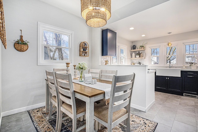 dining area featuring baseboards, visible vents, recessed lighting, and a chandelier