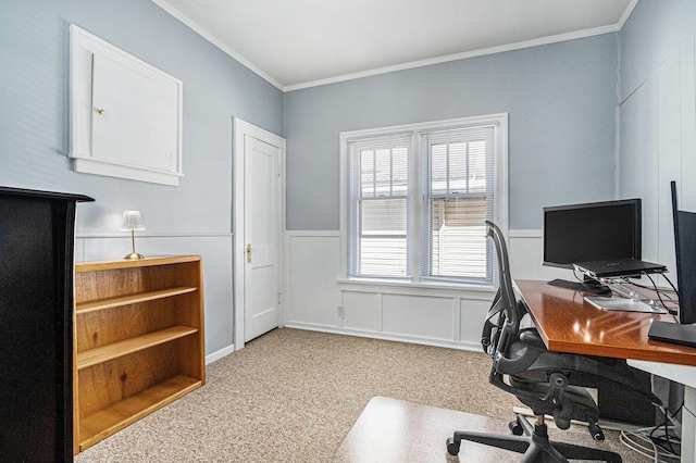home office featuring crown molding, carpet, and a wainscoted wall
