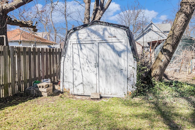view of shed with fence