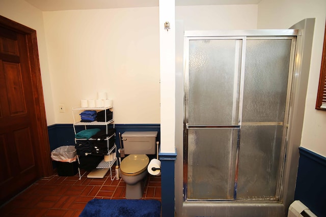53240 Hemlock Lake Rd, Marcellus, MI 49067 - bathroom with a shower stall, toilet, brick patterned floors, and a baseboard heating unit