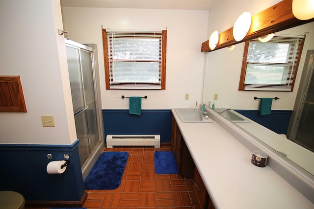 53240 Hemlock Lake Rd, Marcellus, MI 49067 - full bath featuring baseboard heating, a shower stall, double vanity, brick patterned flooring, and toilet