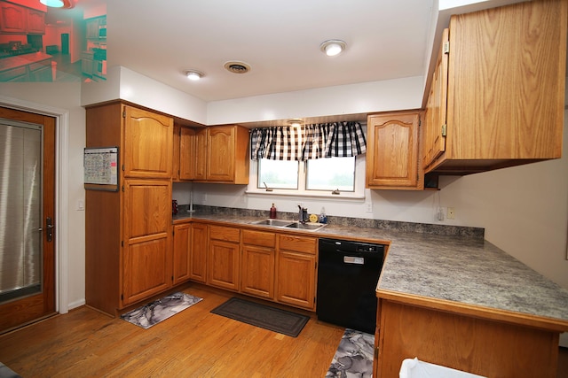 53240 Hemlock Lake Rd, Marcellus, MI 49067 - kitchen featuring dishwasher, a sink, light wood finished floors, and brown cabinets