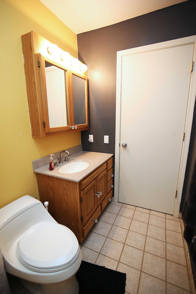 53240 Hemlock Lake Rd, Marcellus, MI 49067 - bathroom with vanity, toilet, and tile patterned floors