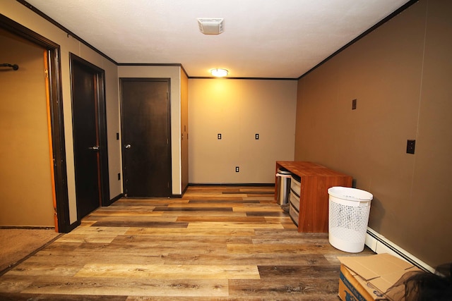 53240 Hemlock Lake Rd, Marcellus, MI 49067 - hall with crown molding, light wood-type flooring, a baseboard heating unit, and baseboards