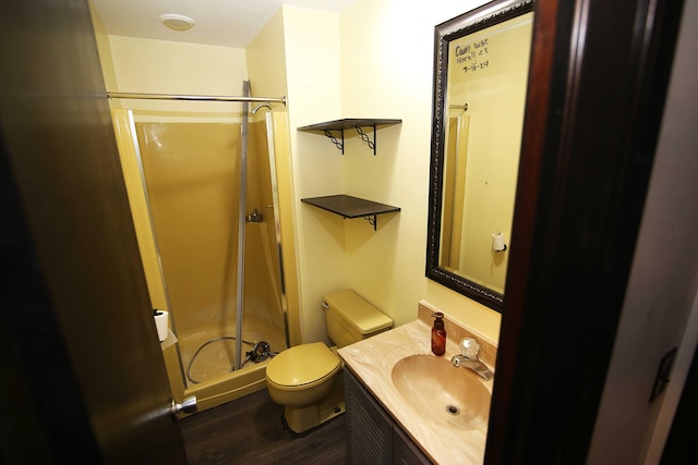 53240 Hemlock Lake Rd, Marcellus, MI 49067 - full bathroom featuring a shower stall, toilet, wood finished floors, and vanity