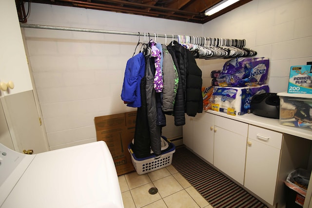 53240 Hemlock Lake Rd, Marcellus, MI 49067 - laundry room featuring light tile patterned floors and concrete block wall