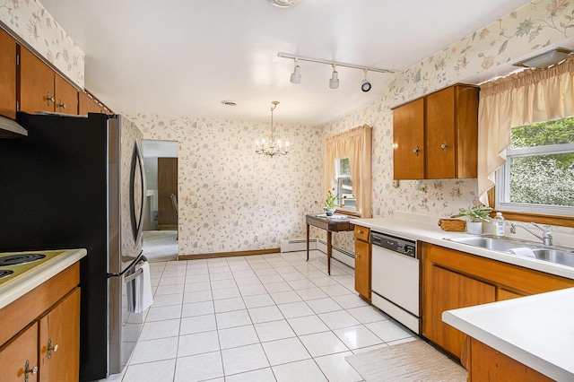 kitchen featuring brown cabinets, dishwasher, a sink, an inviting chandelier, and wallpapered walls
