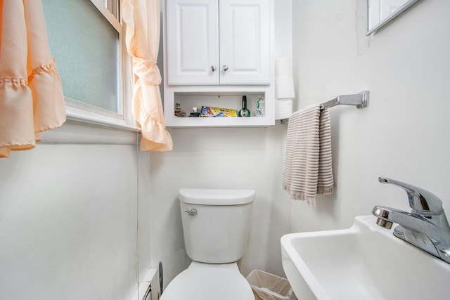 bathroom with a sink and toilet