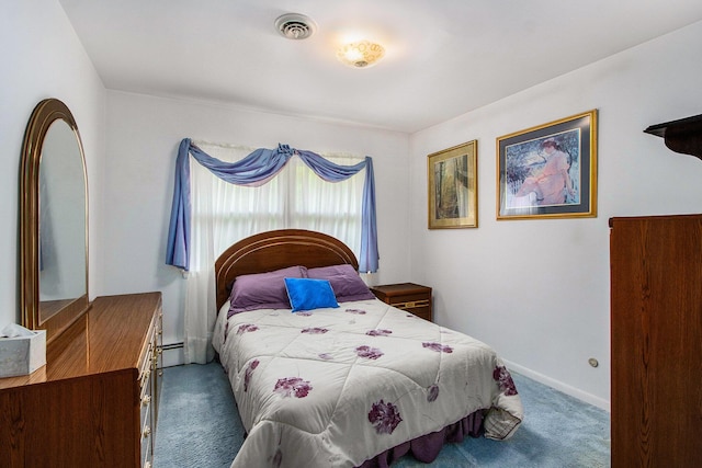 bedroom featuring carpet floors, baseboards, visible vents, and baseboard heating