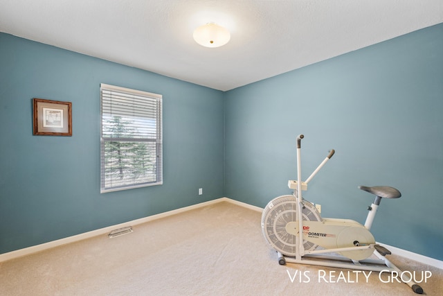 miscellaneous room featuring baseboards, carpet, and visible vents