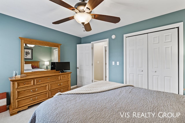 carpeted bedroom featuring baseboards, ceiling fan, and a closet