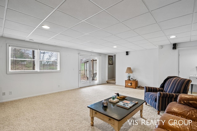 living area featuring baseboards, carpet, recessed lighting, and a paneled ceiling