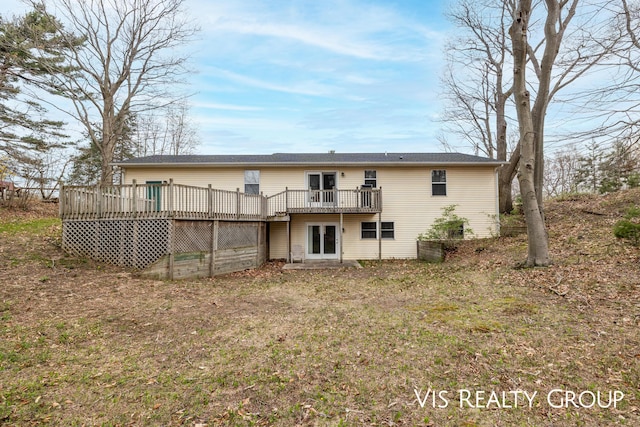 back of property with a deck