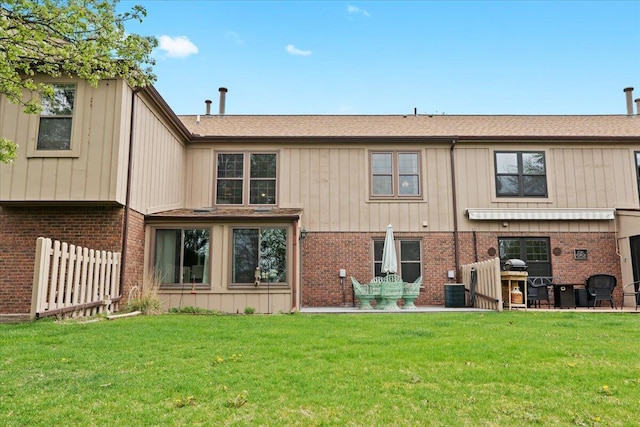 11771 Shenandoah Dr, Green Oak Twp, MI 48178 - back of property with brick siding, a shingled roof, and central air condition unit