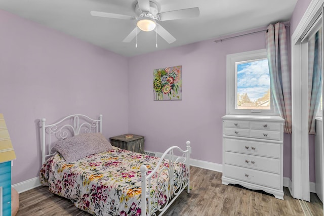 109 Diversy Dr, Brooklyn, MI 49230 - bedroom featuring baseboards, ceiling fan, and wood finished floors