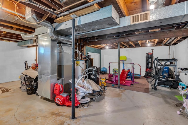 109 Diversy Dr, Brooklyn, MI 49230 - unfinished basement featuring visible vents, heating unit, and gas water heater