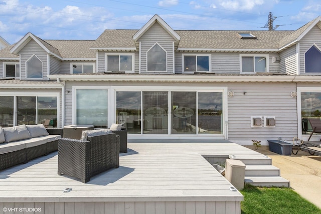 257 Shoreview Way Unit 9, Saint Joseph, MI 49085 - back of house with an outdoor hangout area, a deck, and a shingled roof