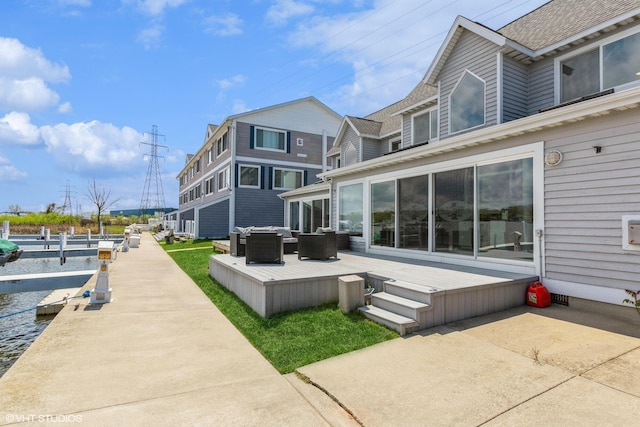 257 Shoreview Way Unit 9, Saint Joseph, MI 49085 - back of house with an outdoor hangout area, a wooden deck, and roof with shingles