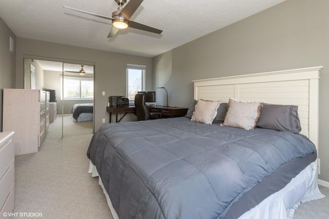 257 Shoreview Way Unit 9, Saint Joseph, MI 49085 - bedroom with light colored carpet, a ceiling fan, and baseboards