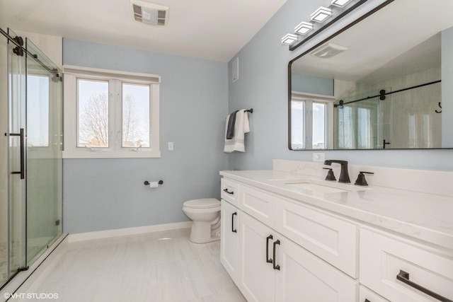 257 Shoreview Way Unit 9, Saint Joseph, MI 49085 - full bathroom featuring baseboards, healthy amount of natural light, a stall shower, and toilet