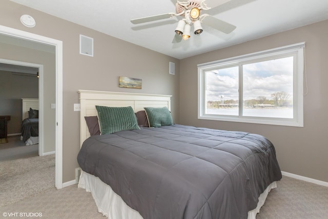 257 Shoreview Way Unit 9, Saint Joseph, MI 49085 - bedroom featuring light carpet, baseboards, and ceiling fan