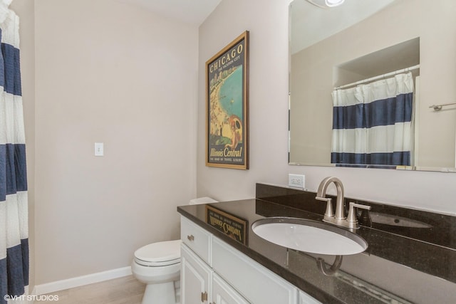257 Shoreview Way Unit 9, Saint Joseph, MI 49085 - bathroom with toilet, vanity, baseboards, and a shower with shower curtain