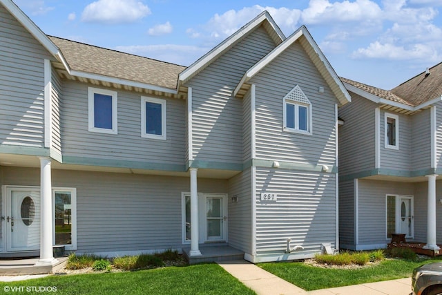 257 Shoreview Way Unit 9, Saint Joseph, MI 49085 - view of property with roof with shingles