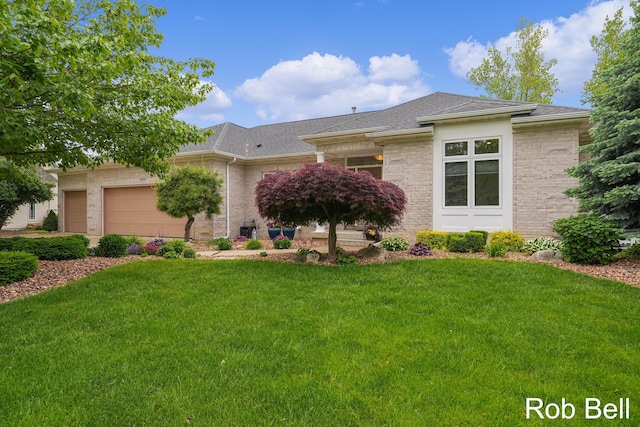 4524 Hidden Ridge Dr, Hudsonville, MI 49426 - view of front of property featuring a garage, a front lawn, a shingled roof, and brick siding