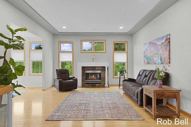 4524 Hidden Ridge Dr, Hudsonville, MI 49426 - living room with light wood finished floors, a tiled fireplace, baseboards, and recessed lighting