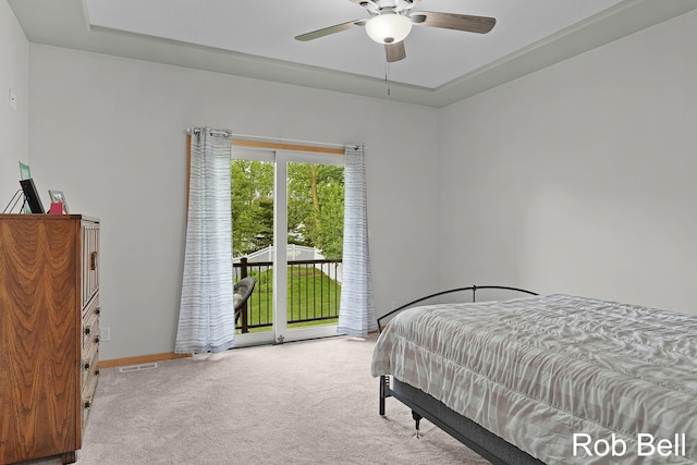 4524 Hidden Ridge Dr, Hudsonville, MI 49426 - bedroom with carpet floors, access to exterior, a raised ceiling, ceiling fan, and baseboards