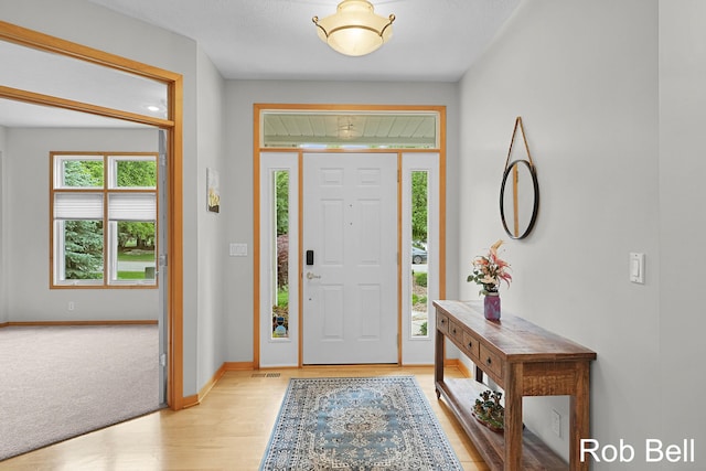 4524 Hidden Ridge Dr, Hudsonville, MI 49426 - foyer entrance featuring light wood-style flooring and baseboards