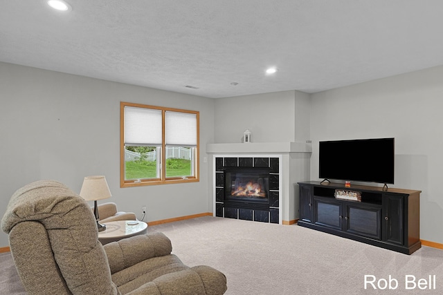 4524 Hidden Ridge Dr, Hudsonville, MI 49426 - carpeted living room with baseboards, a fireplace, and recessed lighting