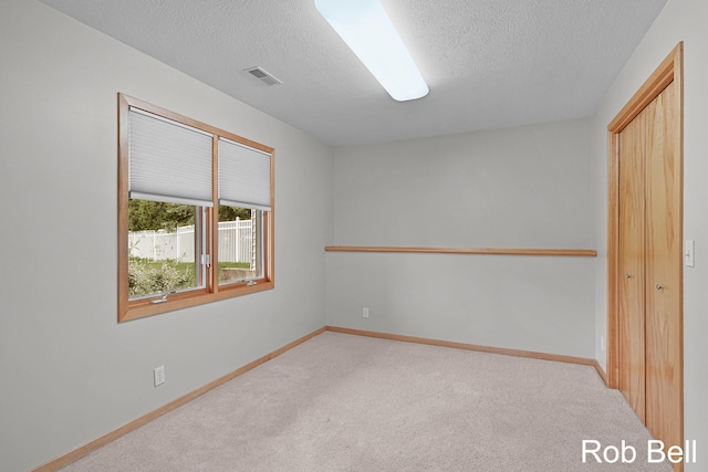 4524 Hidden Ridge Dr, Hudsonville, MI 49426 - unfurnished bedroom with carpet floors, a textured ceiling, and baseboards