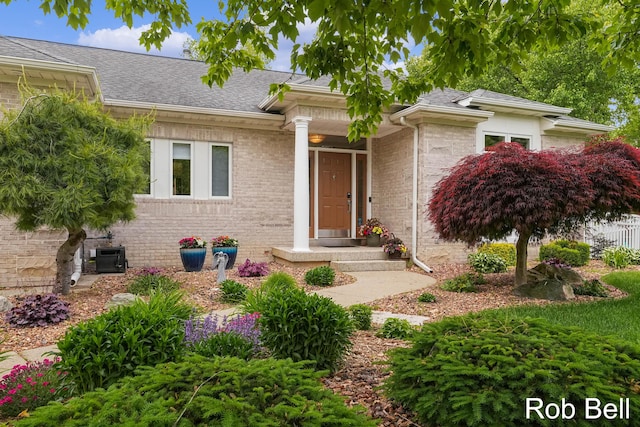 4524 Hidden Ridge Dr, Hudsonville, MI 49426 - view of front facade featuring brick siding and a shingled roof