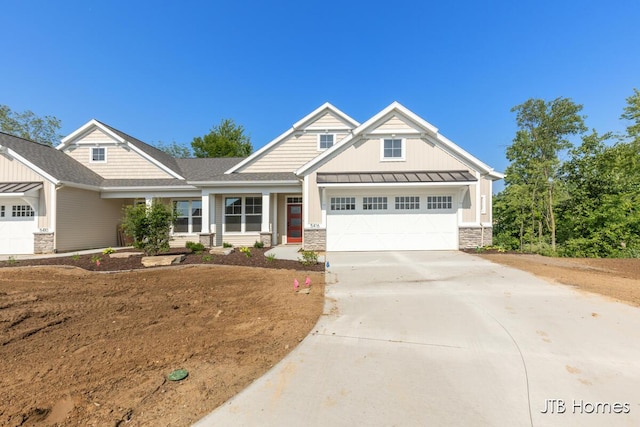5416 Albright Ave SW Unit 39, Wyoming, MI 49418 - craftsman house featuring a standing seam roof, stone siding, board and batten siding, and an attached garage