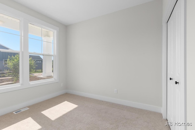 5416 Albright Ave SW Unit 39, Wyoming, MI 49418 - unfurnished bedroom with light colored carpet and a closet