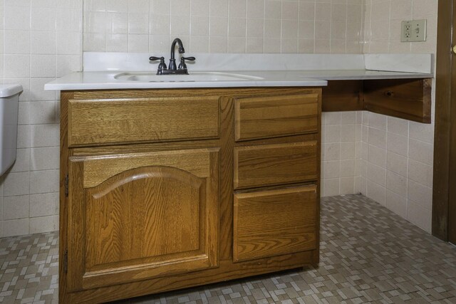 1620 Whittier Rd, Ypsilanti, MI 48197 - detailed view of a sink, tile walls, and backsplash