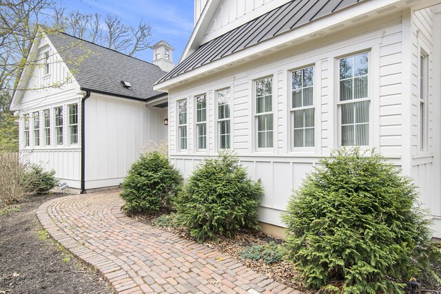 16220 Stones Throw Ln, Union Pier, MI 49129 - view of property exterior featuring a standing seam roof and board and batten siding
