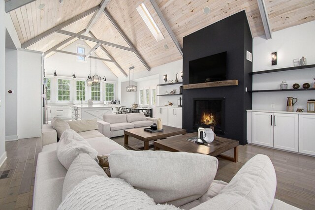 16220 Stones Throw Ln, Union Pier, MI 49129 - living room with beam ceiling, a fireplace, high vaulted ceiling, wooden ceiling, and wood finished floors