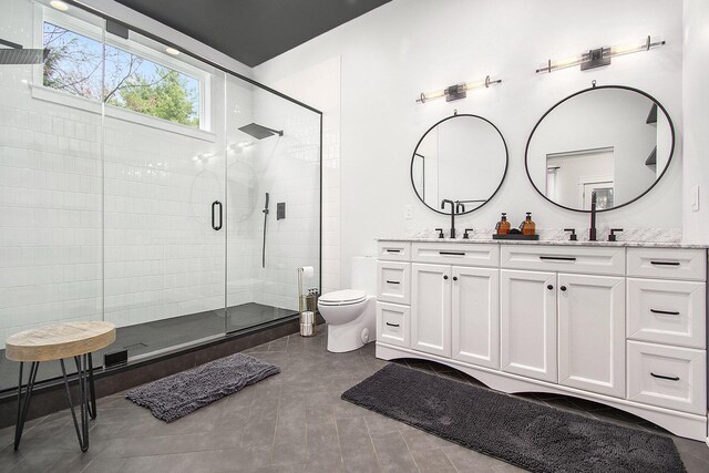16220 Stones Throw Ln, Union Pier, MI 49129 - full bathroom with double vanity, a sink, a stall shower, and toilet