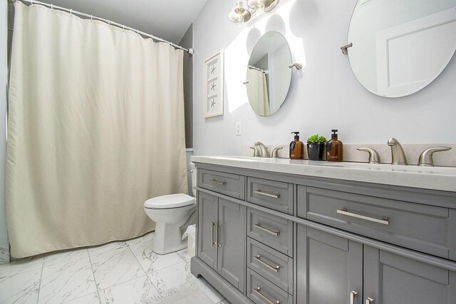 16220 Stones Throw Ln, Union Pier, MI 49129 - bathroom featuring double vanity, toilet, a sink, and marble finish floor