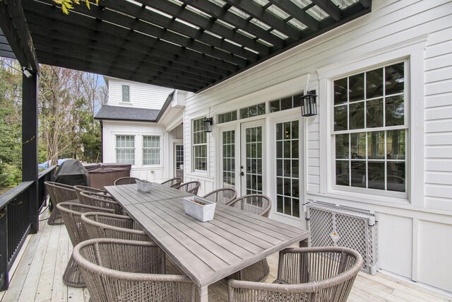 16220 Stones Throw Ln, Union Pier, MI 49129 - wooden deck with a hot tub, french doors, and outdoor dining space