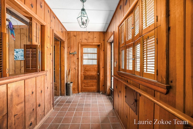 347 Dewitt Ln, Spring Lake, MI 49456 - interior space with wood walls and tile patterned floors