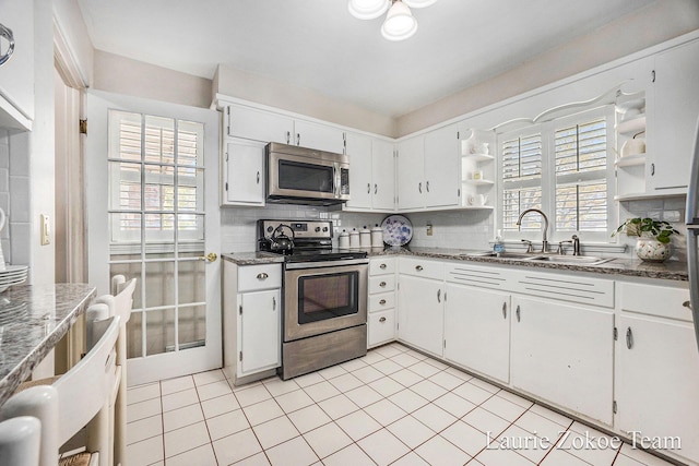 347 Dewitt Ln, Spring Lake, MI 49456 - kitchen with stainless steel appliances, open shelves, a sink, decorative backsplash, and white cabinets