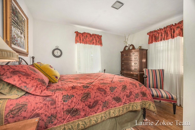 347 Dewitt Ln, Spring Lake, MI 49456 - bedroom featuring multiple windows and wood finished floors