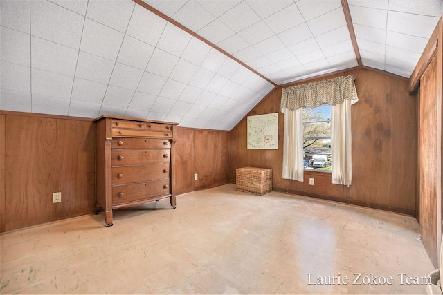 347 Dewitt Ln, Spring Lake, MI 49456 - additional living space with wood walls, tile patterned floors, and lofted ceiling