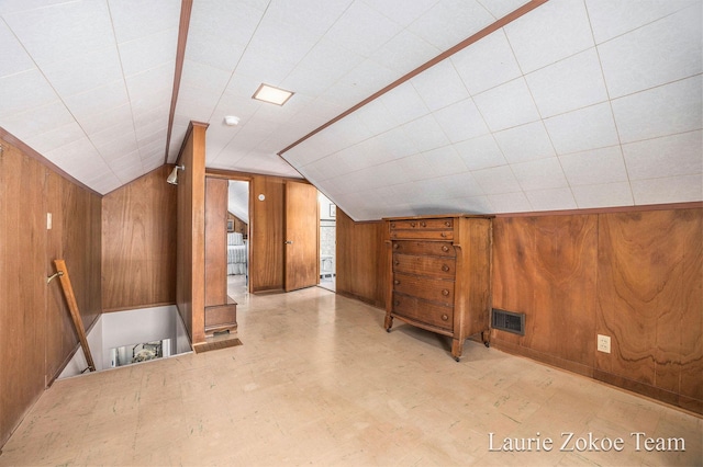347 Dewitt Ln, Spring Lake, MI 49456 - bonus room with wood walls, vaulted ceiling, and tile patterned floors