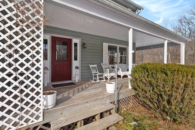 wooden deck featuring covered porch